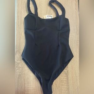 New Haight bodysuit/swimsuit in black. size medium with tags on. Valued at $248